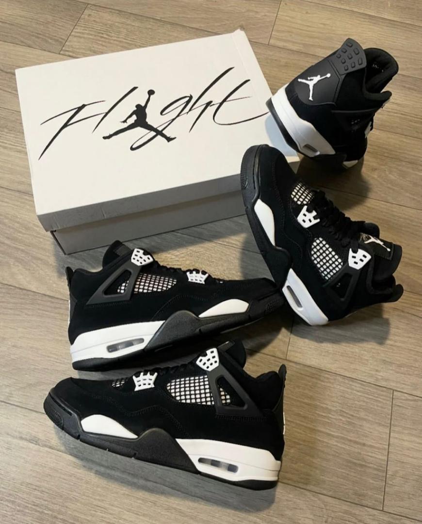 Air jordan 4 retro 'white thunder' – sleek black & white sneakers